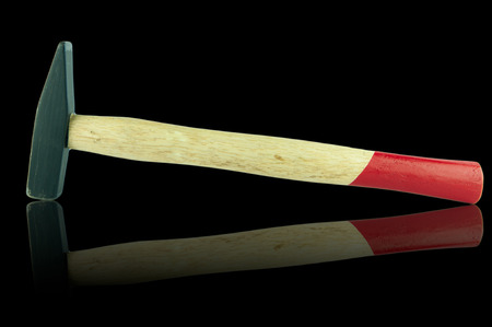 Black metal and yellow and red handle on black background