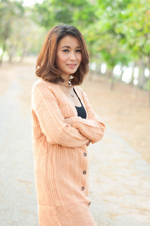 Happy woman in garden backgroundの写真素材