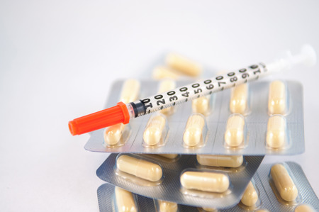 Disposable syringe on blister pack show medicine conceptの写真素材