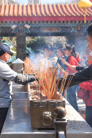 HONG KONG - January 19, 2015 - Hong Kong people visit the Wong Tai Sin Buddhist Temple to pray on January 19, 2015, in Hong Kong.のeditorial素材