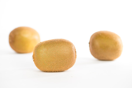 Closed up kiwi fruit on whiteの写真素材