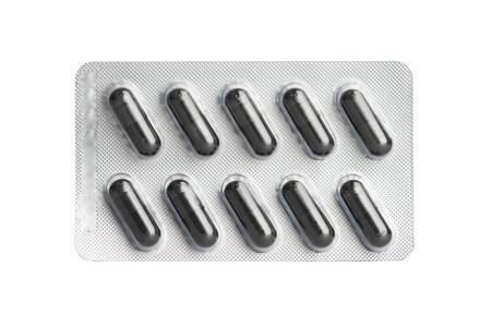 Black capsule in blister packの写真素材