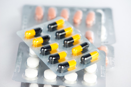 Yellow and black capsule in blister pack