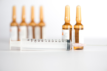 Injection syringe and brown ampule backgroundの写真素材