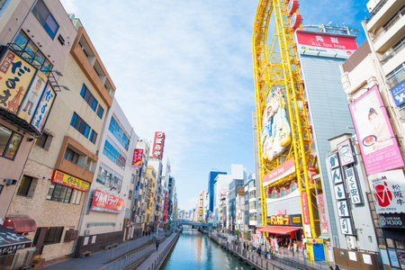 OSAKA,JAPAN - February 2, 2016 :Dotoburi canal contain billbord and foodshop in osaka,japanのeditorial素材