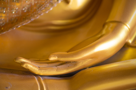 Closed up hand of Buddhaの写真素材