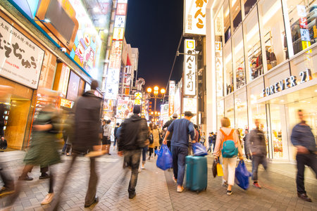 Osaka, Japan -November 10, 2018 :Long expose time photo of  People walking in the Dotonburi, Osaka. Dotonburi is landmark and famous location for tourist in Osaka, Japan.のeditorial素材