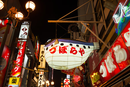 Osaka, Japan -November 10, 2018 :Sign of Puffer fish restuarant in the Dotonburi, Osaka. Dotonburi is landmark and famous location for tourist in Osaka, Japan.のeditorial素材