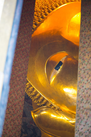 Reclining Buddha gold statue in Wat  Phra Chettuphon Wimon Mangkhalaram (Wat pho), Bangkok, Thailand