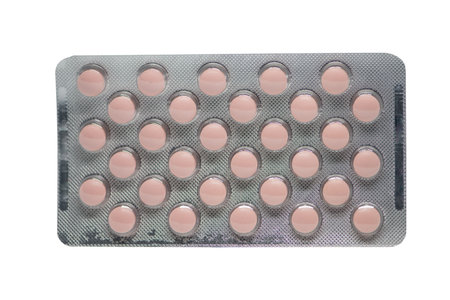 Closed up blister pack of medicine on whiteの写真素材
