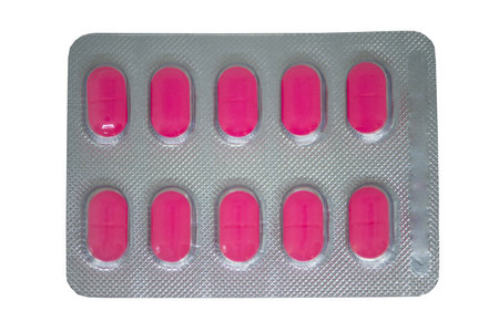 Pink tablet in transparent blister packの写真素材