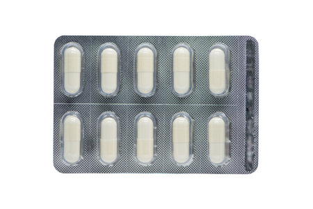 White capsule in blister pack on white backgroundの写真素材