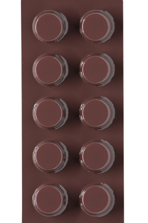 Closed up brown blister pack of medicine on whiteの写真素材