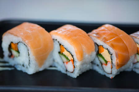 Closed up japanese sushi Maki and rolls show food background