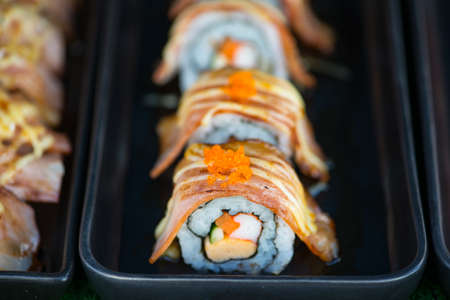 Closed up japanese sushi Maki and rolls show food backgroundの写真素材
