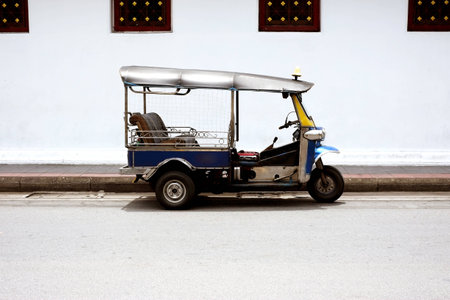 three wheels taxi name tuk tuk ,famous in bangkok thailandの写真素材