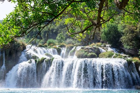 Breathtaking view Waterfalls of Krka National Park, Sunny day, summer season having greenery and trees, Croatiaの写真素材