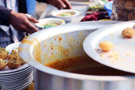 Fusca Chotpoti is Popular street food of Bangladesh and India. this food Looks like chips.a roadside shop Indian bengali food dish and pot.Testy and lucrative food.The dish consists mainly of potatoesの写真素材