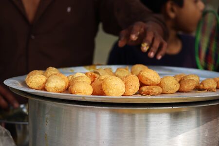 Fusca Chotpoti is Popular street food of Bangladesh and India. this food Looks like chips.a roadside shop Indian bengali food dish and pot.Testy and lucrative food.The dish consists mainly of potatoesの写真素材