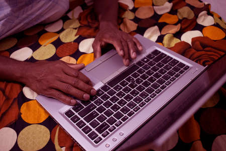 Man Press black key on keyboard in Gray color Laptop.Close up Laptop Keyboard with Touch pad.Hand...