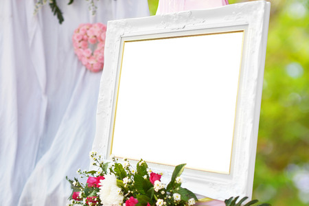 white photo frame with flower in wedding day