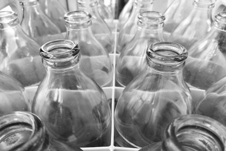 glass bottles in plastic crateの写真素材