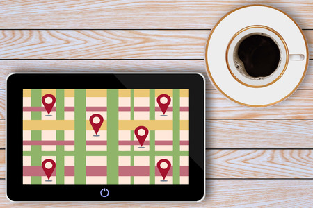 tablet computer and coffee cup