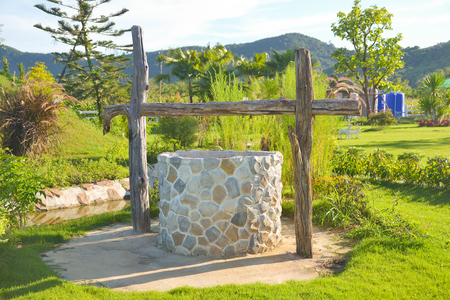 water well in beautiful gardenの写真素材