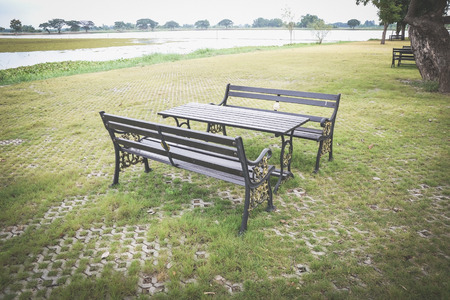 table and chairs in relaxing zone at public parkの写真素材