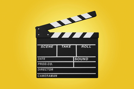 clapperboard isolated on yellow backgroundの写真素材