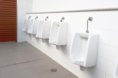 urinals in men public toiletの写真素材
