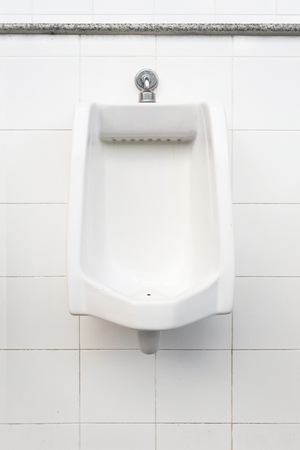 urinals in men public toiletの写真素材