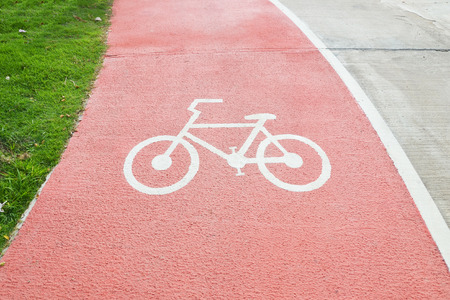 close up bicycle symbol on red street, bicycle pathの写真素材