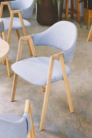 Modern gray fabric wooden chair decoration in living roomの写真素材