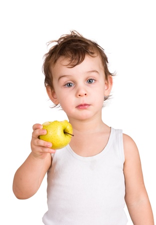 Little boy eating an apple. Isolated on white の写真素材