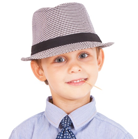 Portrait of cool pretty stylish little boy with toothpick  Isolated on white background  Clipping paths included の写真素材