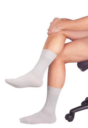 Male legs in socks. Isolated on white backgroundの写真素材