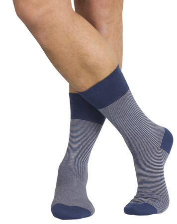 Male legs in socks. Isolated on white backgroundの写真素材