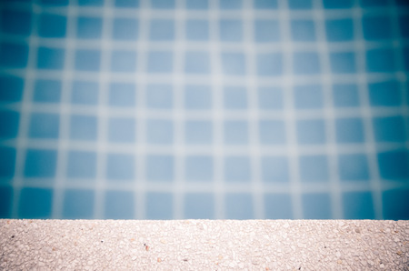 white sand stone pavement with pool edge background