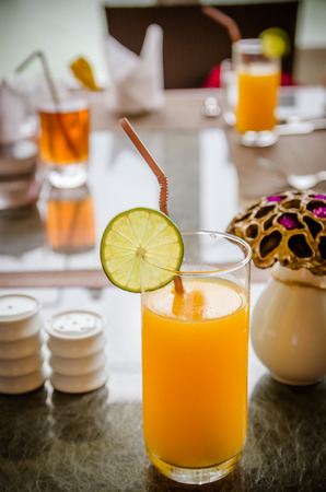 Orange juice and fruit  on tableの写真素材