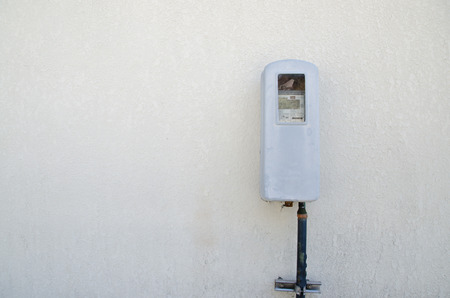 the Old electric meter on a wallの写真素材