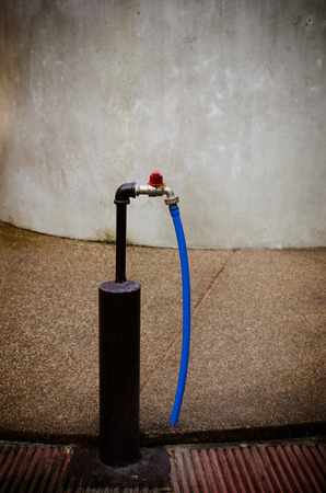 Faucet with blue rubber wireの写真素材