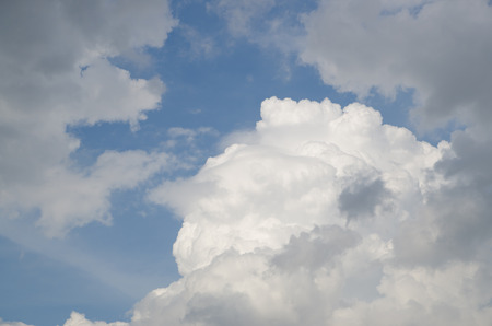 Blue sky, clouds and sun light backgroundの写真素材