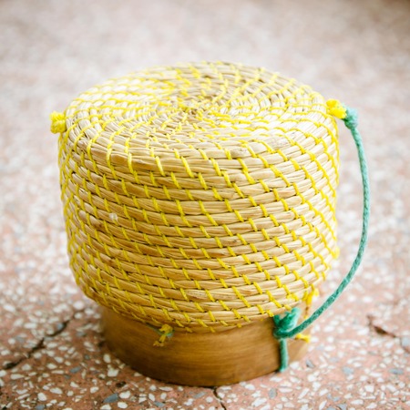 A basket weave pattern with palm leaves for the sticky rice steamed inside.の写真素材