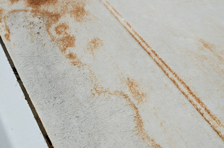 Closeup of cracked and peeling paint on an old carの写真素材