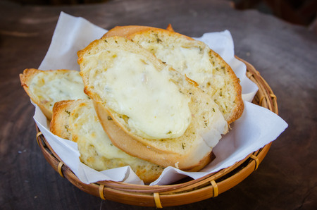 Toasted Cheese and Garlic Bread on wood table