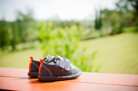 A pair of denim baby shoes for the toddlers feet.の写真素材