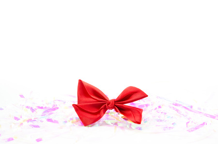Red bow ribbon isolated on white with empty spaceの写真素材