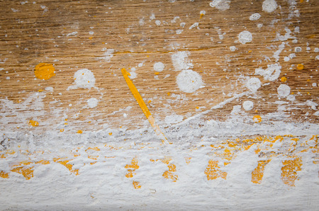 white and yellow color dirty on woodの写真素材