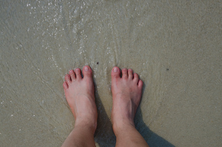 View from above of man Feet over the beachの写真素材